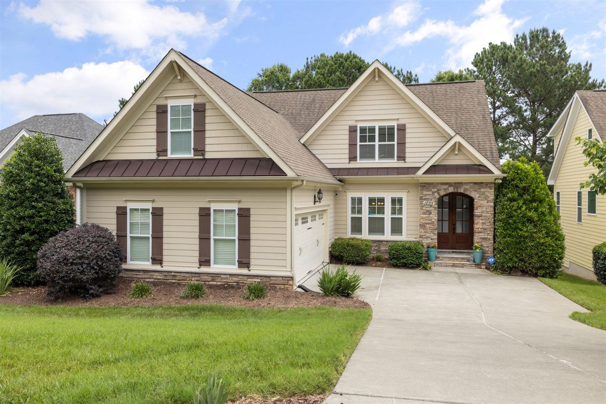Stock photograph of a maintained lawn and landscaped home
